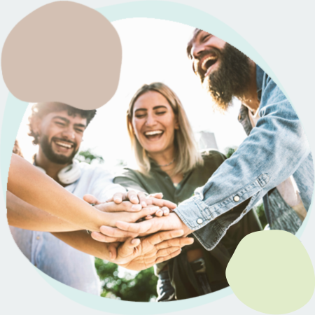 group of friends with their hands on top of each other